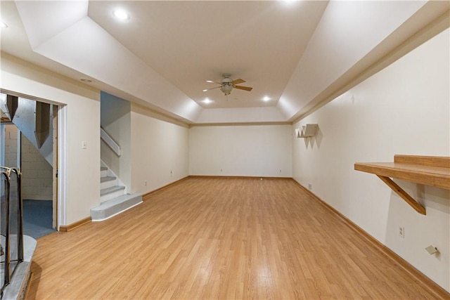 interior space featuring ceiling fan, vaulted ceiling, and light hardwood / wood-style flooring