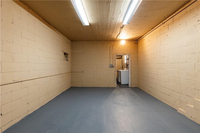 basement featuring washer / clothes dryer and wooden ceiling