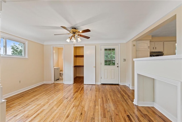 interior space with ceiling fan and light hardwood / wood-style floors