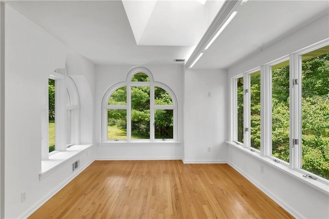 unfurnished sunroom featuring a wealth of natural light