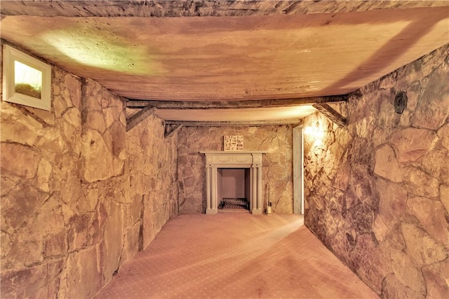 interior space featuring carpet flooring and wooden ceiling