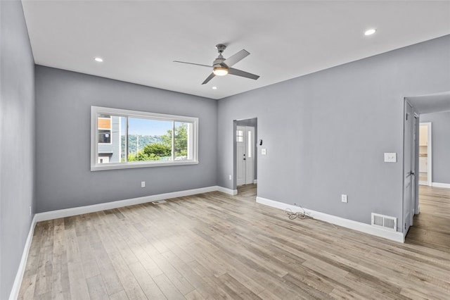 unfurnished room featuring ceiling fan and light hardwood / wood-style floors