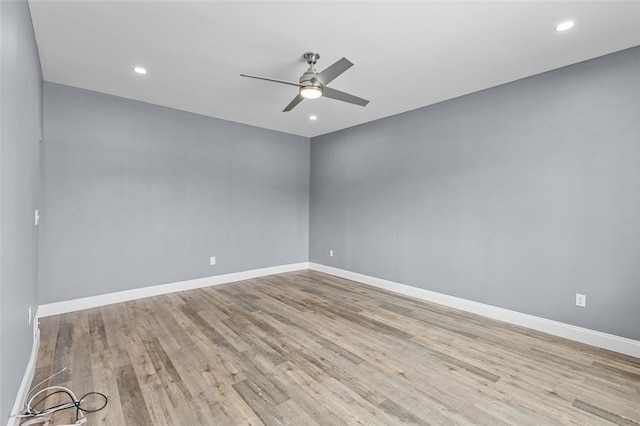 spare room with ceiling fan and light hardwood / wood-style flooring