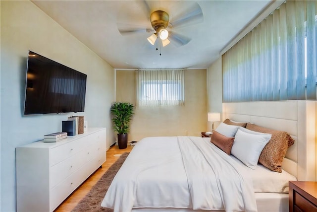 bedroom featuring light hardwood / wood-style floors and ceiling fan