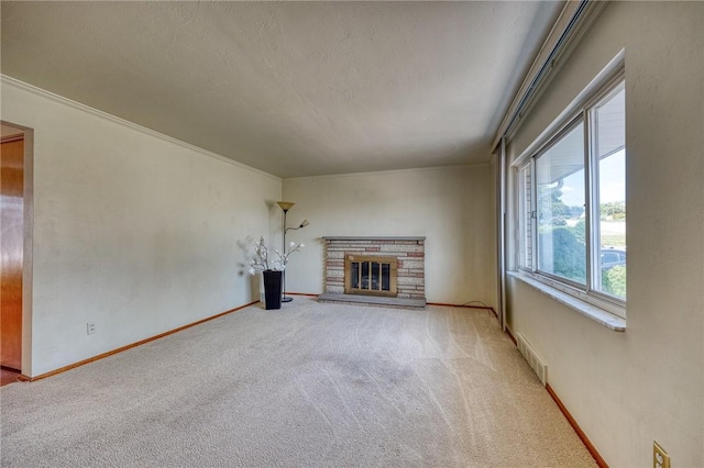 unfurnished living room with carpet flooring and a fireplace