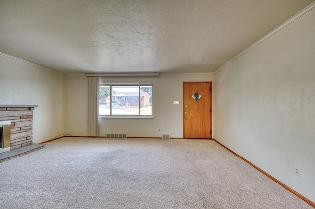 unfurnished living room featuring a stone fireplace, light colored carpet, and ornamental molding