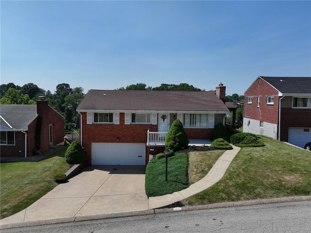 view of front facade with a garage and a front lawn