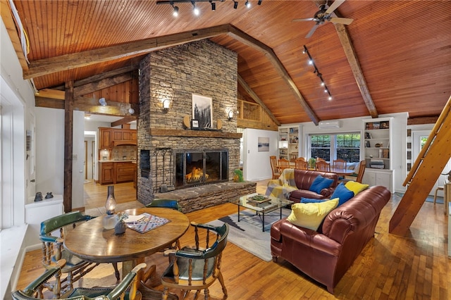 living room with ceiling fan, high vaulted ceiling, light hardwood / wood-style flooring, and wooden ceiling