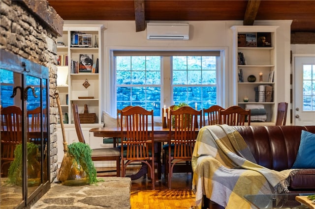 dining space with beamed ceiling, a healthy amount of sunlight, a wall mounted air conditioner, and wood ceiling