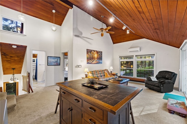 kitchen featuring an AC wall unit, decorative light fixtures, light colored carpet, and wooden ceiling