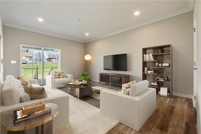 living room with hardwood / wood-style flooring and ornamental molding