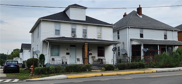 view of property featuring covered porch