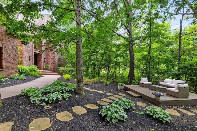 exterior space with an outdoor living space and a deck