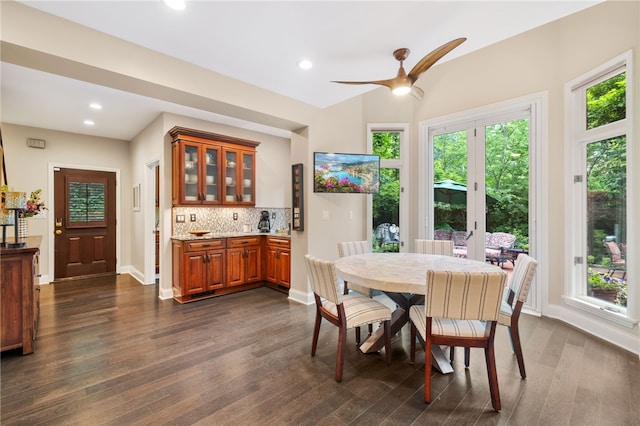 dining area with dark hardwood / wood-style floors and ceiling fan