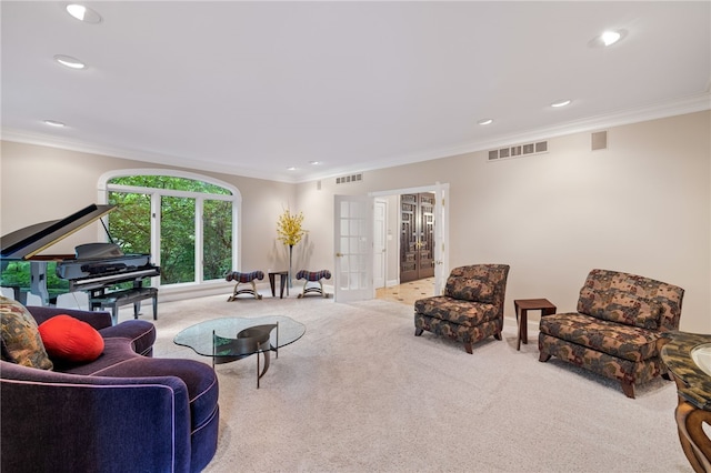 carpeted living room featuring french doors and ornamental molding