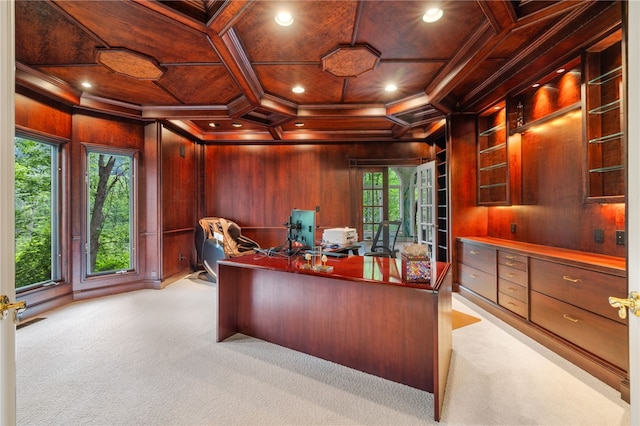 office space with wooden walls, wooden ceiling, coffered ceiling, and ornamental molding