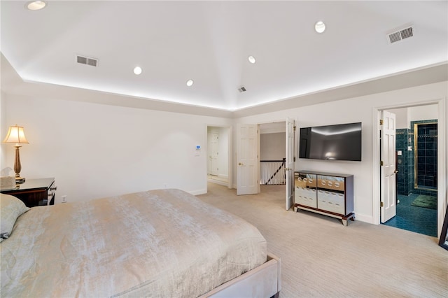 carpeted bedroom with ensuite bathroom