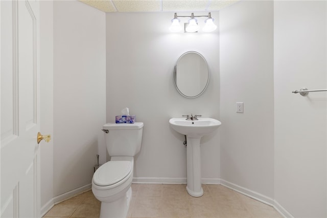 bathroom with tile patterned floors, sink, and toilet