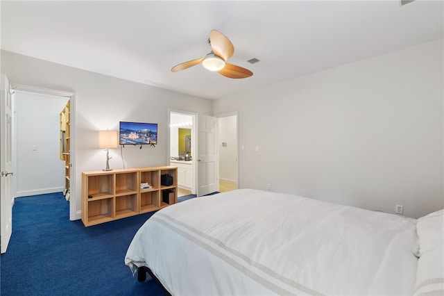 carpeted bedroom featuring ceiling fan and connected bathroom