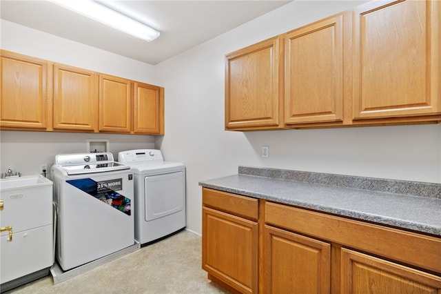 laundry area with cabinets and washer and dryer