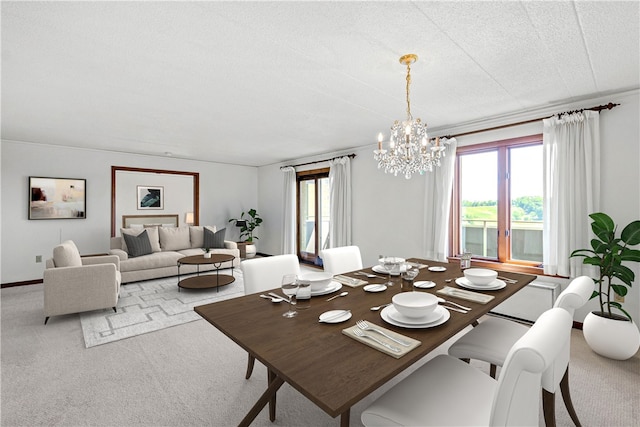 carpeted dining space featuring a notable chandelier and a textured ceiling