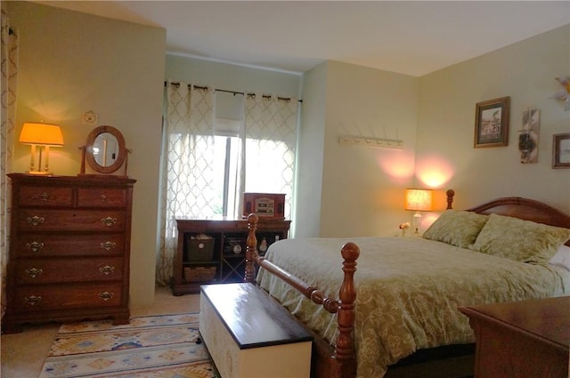 bedroom with light colored carpet