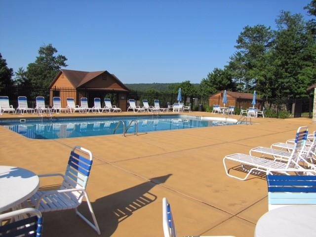 view of swimming pool featuring a patio area