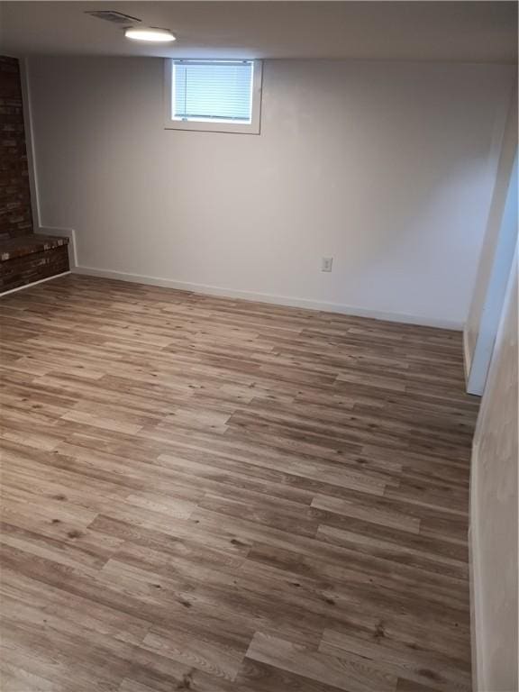 basement featuring wood-type flooring