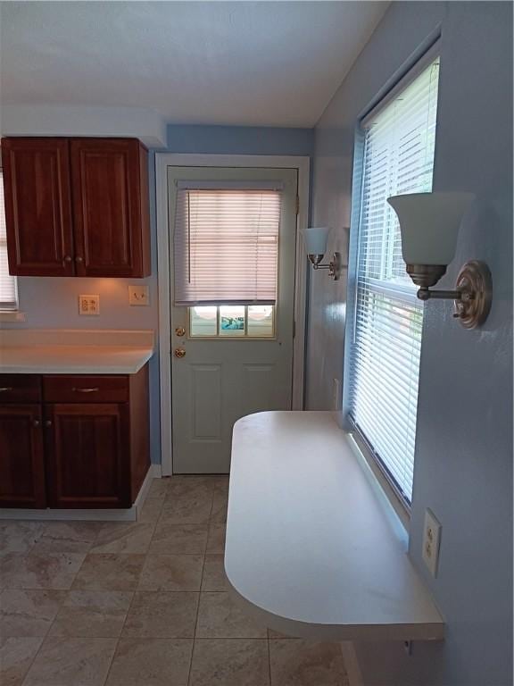 doorway featuring light tile patterned floors