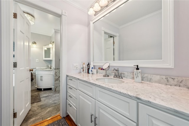 bathroom with crown molding, tile flooring, and vanity