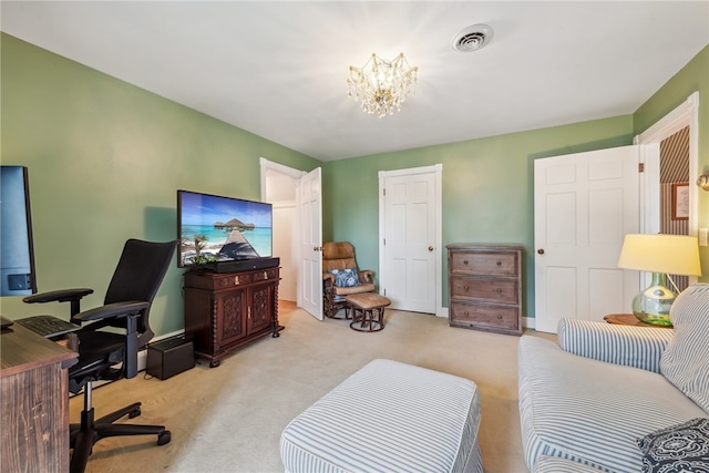 office featuring carpet floors and an inviting chandelier