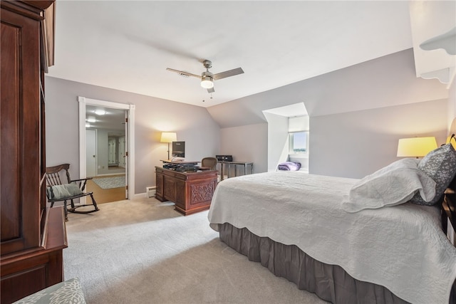 bedroom featuring ceiling fan, vaulted ceiling, and light colored carpet