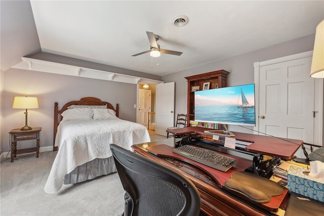 bedroom with ceiling fan and light colored carpet