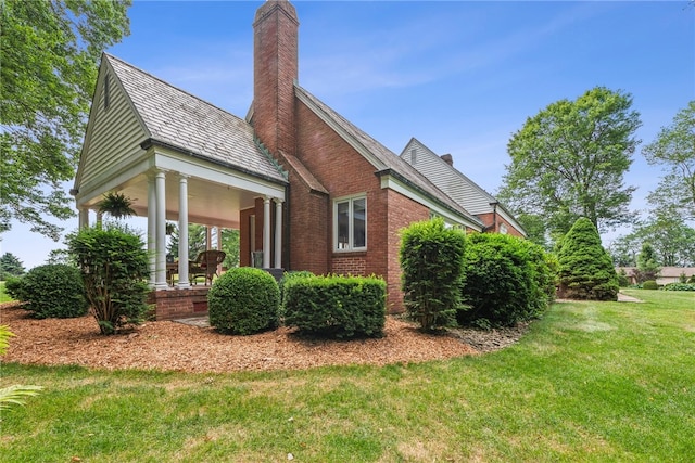 view of home's exterior featuring a yard