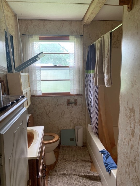 full bathroom with vanity, toilet, and shower / bath combo with shower curtain