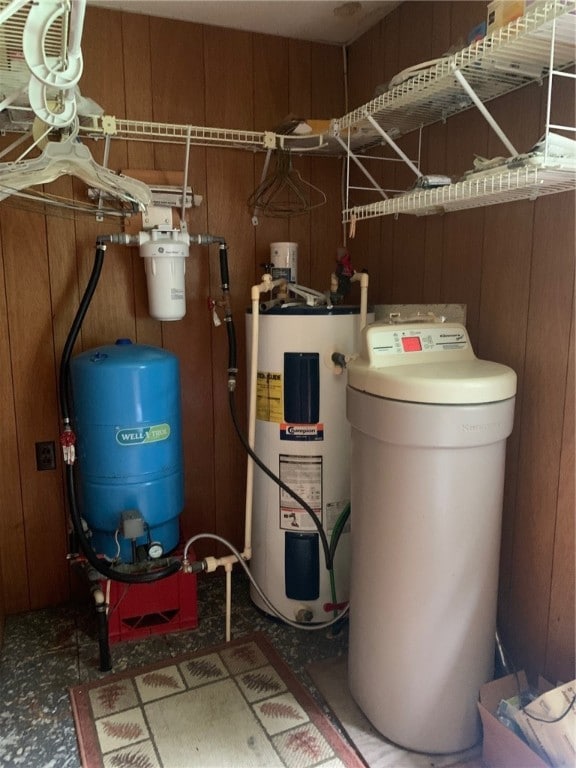 utility room featuring water heater