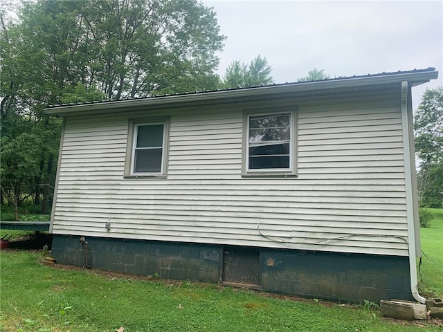 view of property exterior featuring a yard