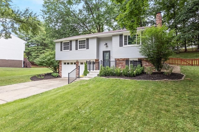 split foyer home with a front lawn and a garage