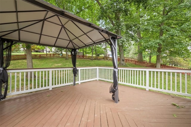 deck featuring a gazebo and a yard