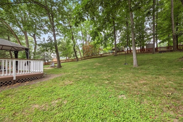 view of yard with a deck and a gazebo