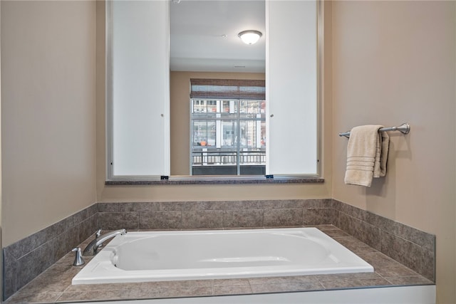 bathroom featuring tiled bath