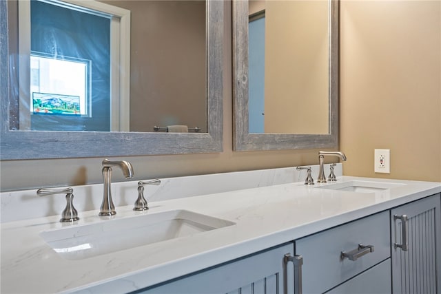 bathroom featuring double vanity