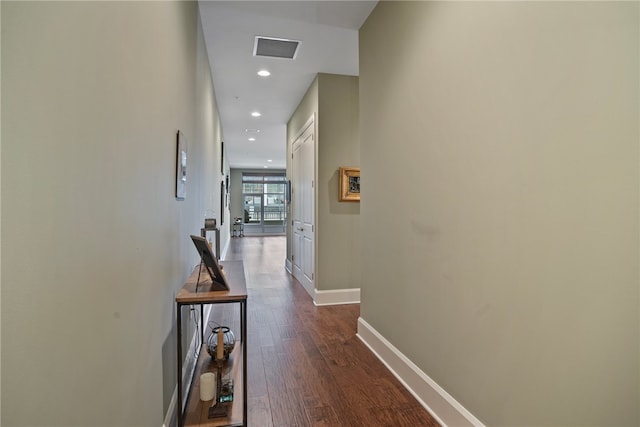 corridor featuring dark hardwood / wood-style flooring