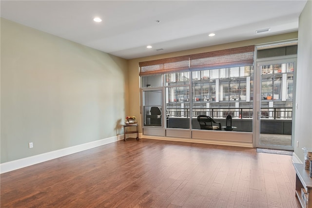 empty room with wood-type flooring