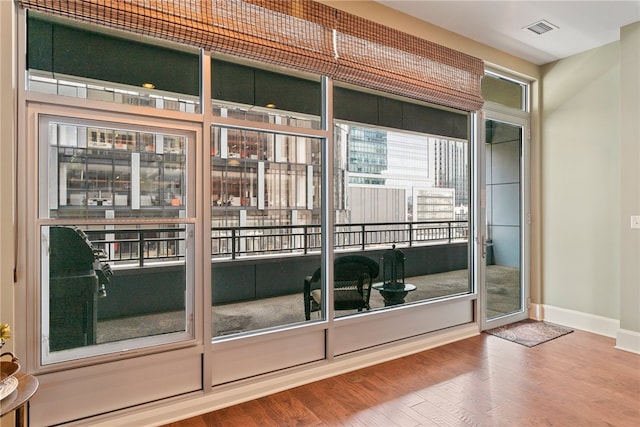 doorway to outside with hardwood / wood-style flooring