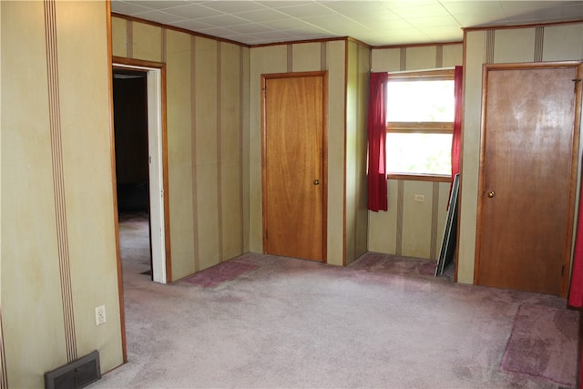 unfurnished bedroom featuring a closet and carpet floors