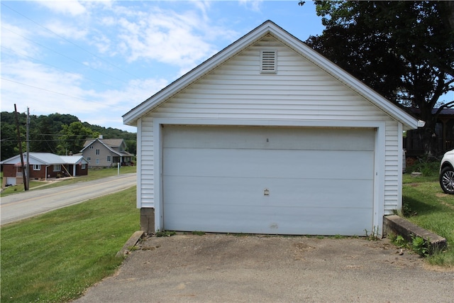 garage with a lawn