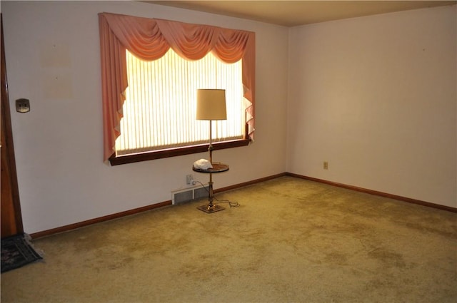 spare room with light carpet