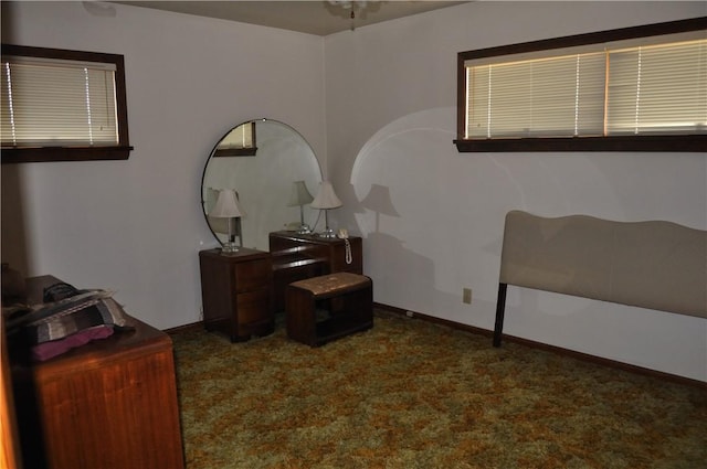 bedroom featuring dark colored carpet