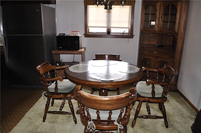 dining area featuring carpet